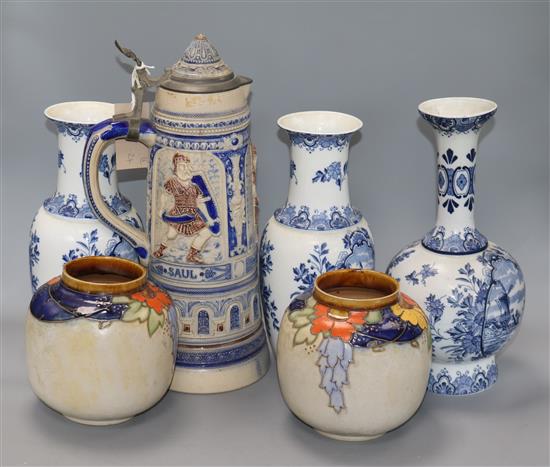 A pair of Doulton stoneware jars, three Delft vases and a large German stein